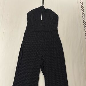 Black printed Alexis Halter silk jumpsuit. So flattering, easy to wear.